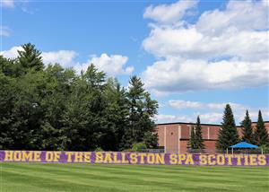 Image of the front lawn of the district with the words Home of the Ballston Spa Scotties.