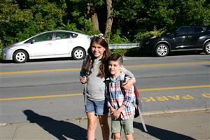 Two smiling students posing for a picture.